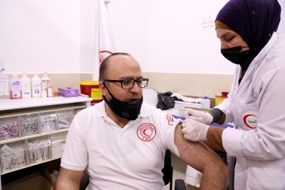 COVID-19 vaccine uptake and its associated factors among Palestinian healthcare workers: Expectations beaten by reality